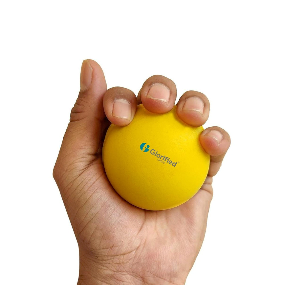 Soft yellow stress relief exercise ball for hand therapy and relaxation